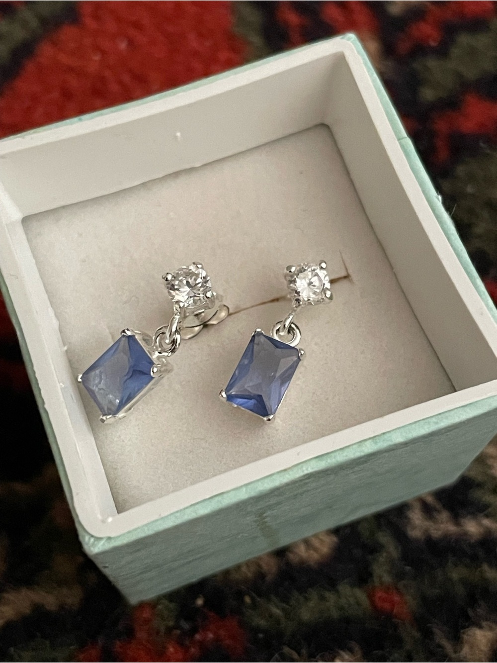 Cute silver tone earrings with blue stones